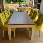 101/01 wooden dining table with six upholstered yellow chairs