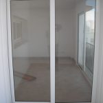 103/01 white aluminium-framed glass sliding door
