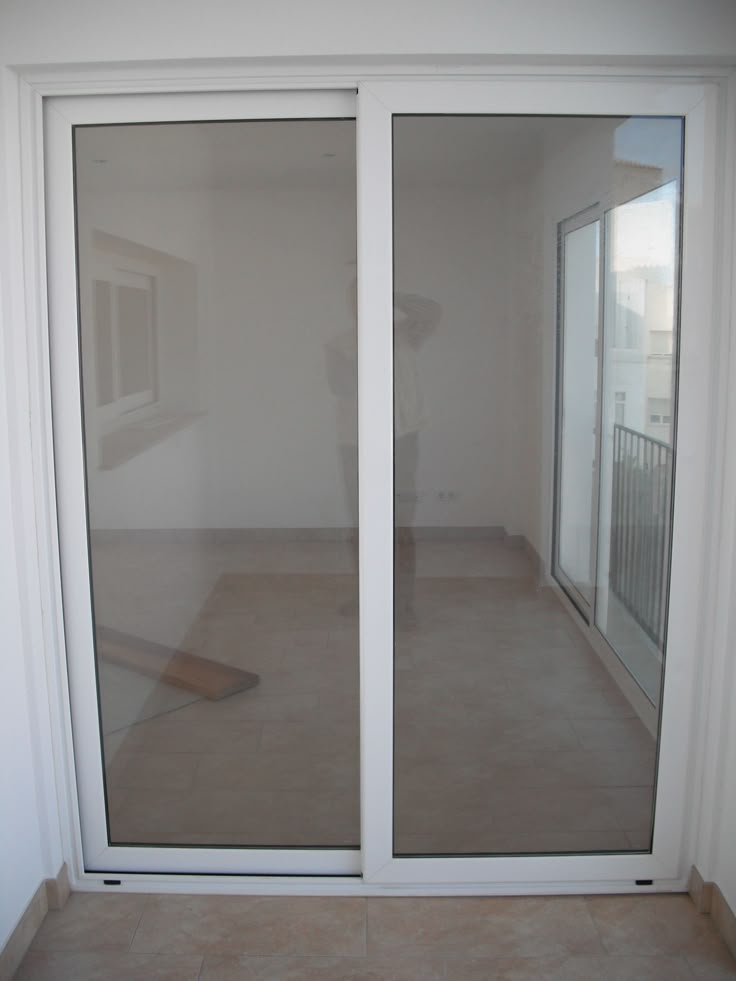 white aluminium-framed glass sliding door