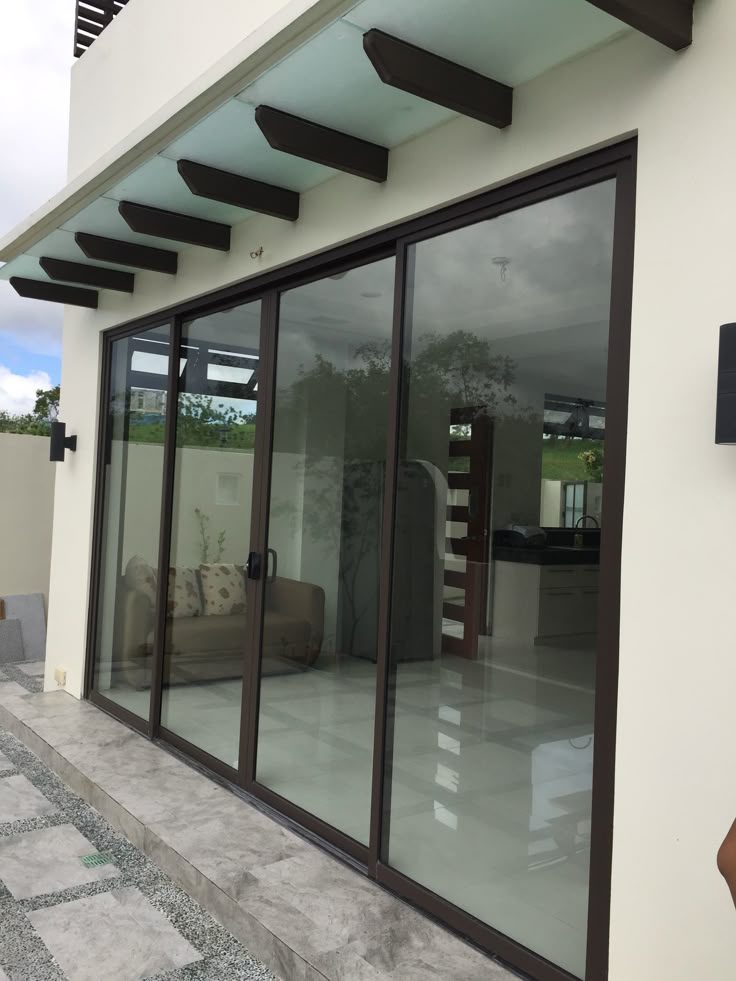 modern dark-framed aluminum and glass sliding door