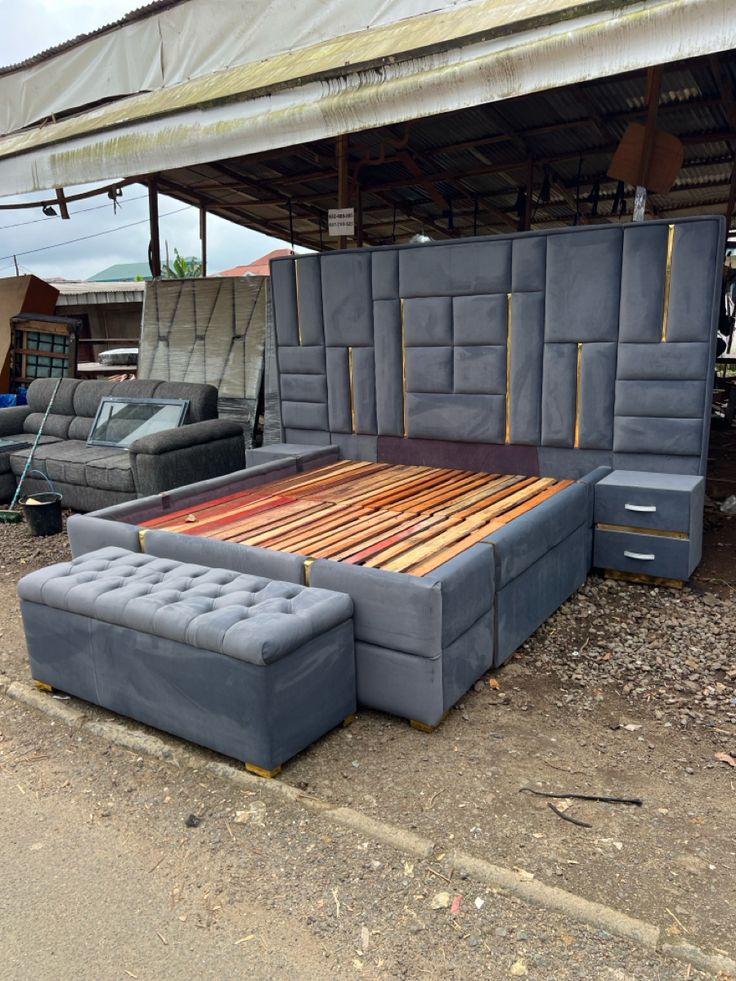 a grey velvet king-size bed frame