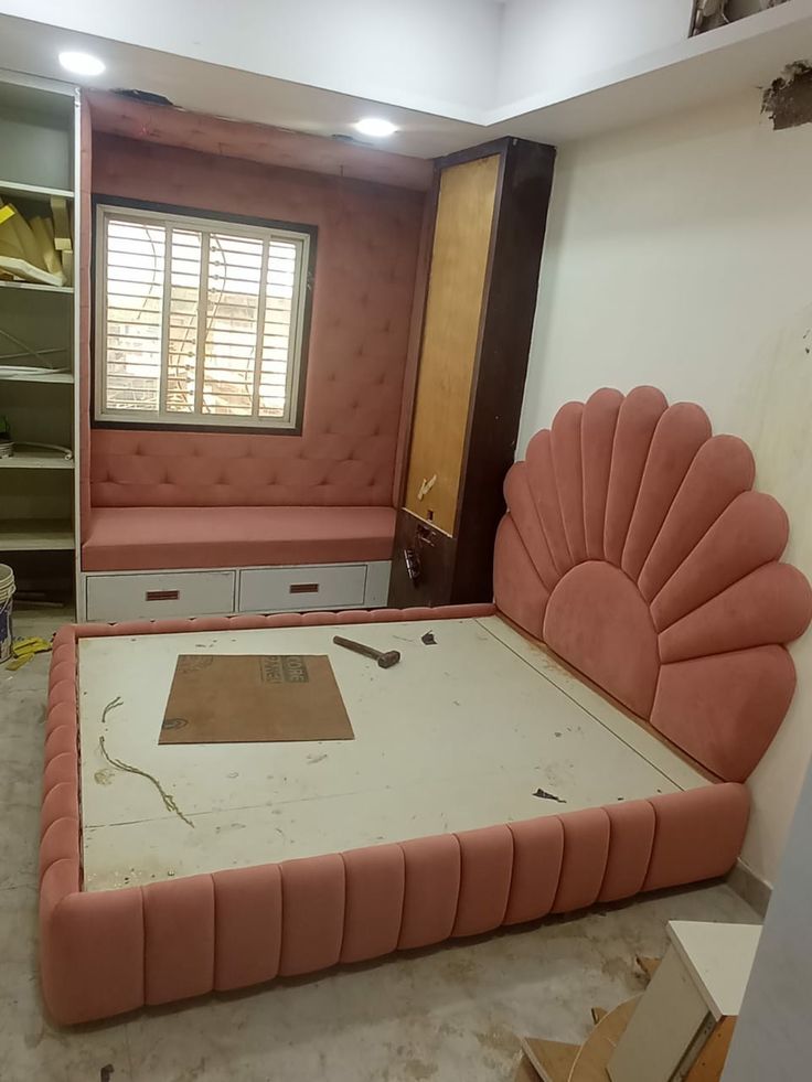 upholstered bed frame with a scalloped headboard