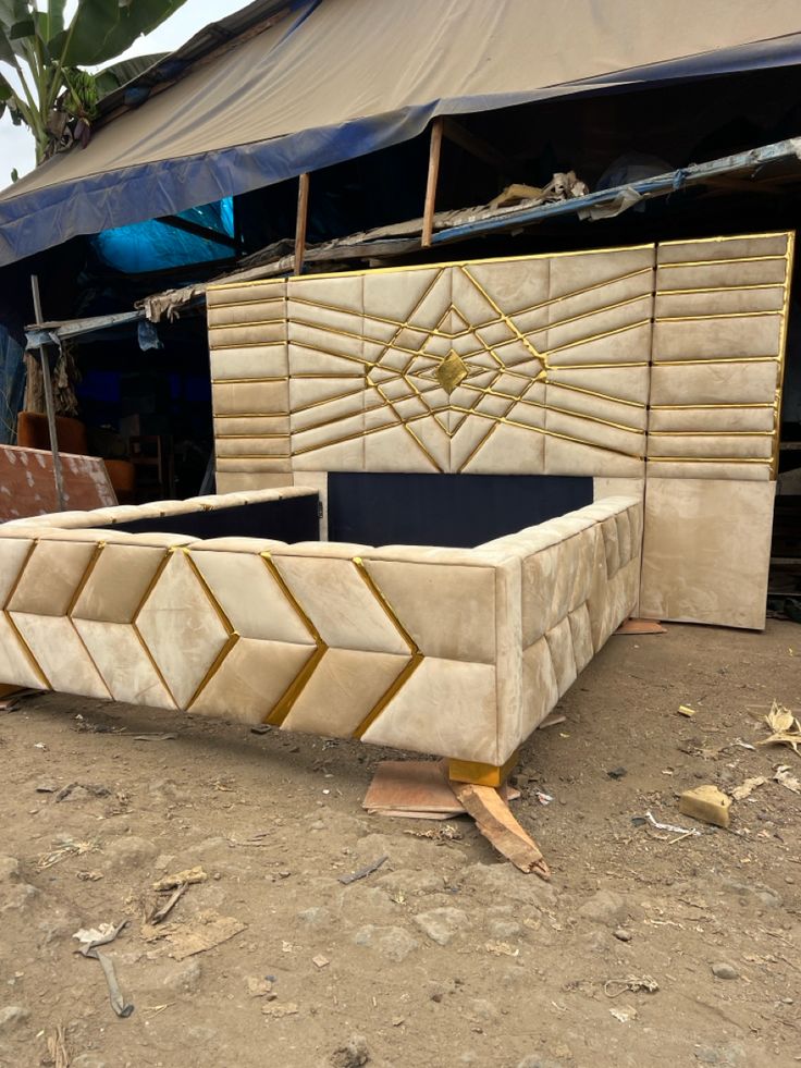 modern, upholstered geometric bed frame in a beige fabric